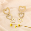 Boucles d'oreilles pendantes acier coeurs striés 0324102 doré