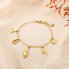 Bracelet acier coquillage corail queue de baleine 0225164 doré