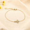 Bracelet acier inoxydable strass pendentif croix 0225585 doré