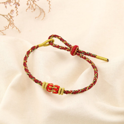Bracelet ethnique tressé coulissant polyester 0225586 rouge bordeaux