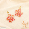 Boucles d’oreilles créoles acier fleur résine 0326134 rouge corail