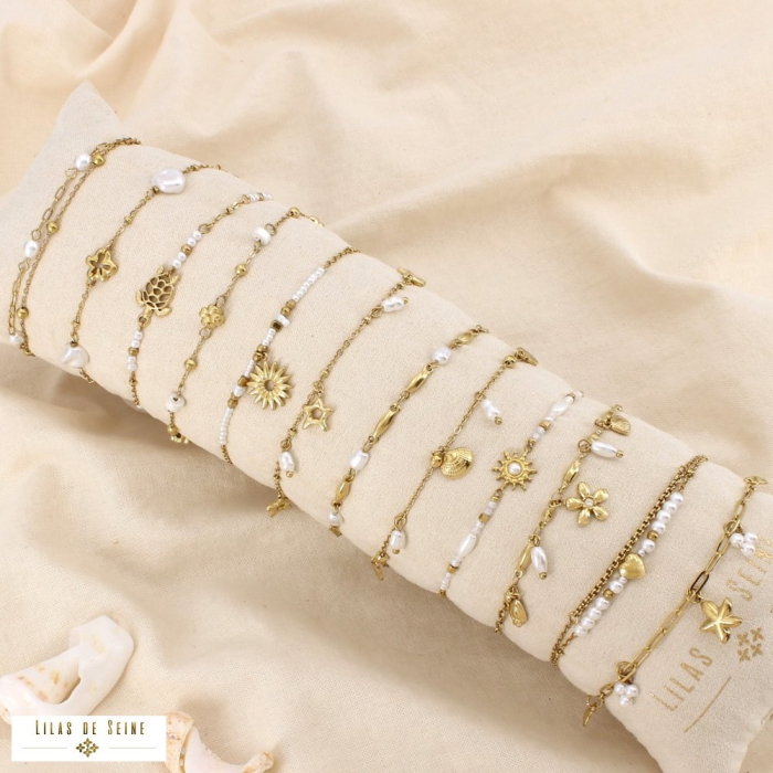 Ensemble 12 bracelets acier inox perle acrylique 0226197 doré